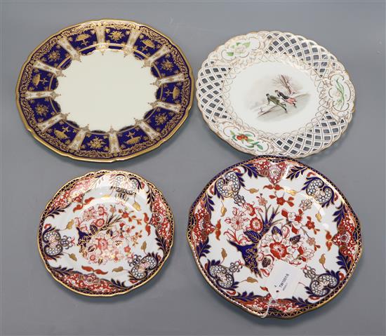 Two Royal Crown Derby Imari Kings pattern plates, a Minton Skating plate and a Royal Doulton cabinet plate